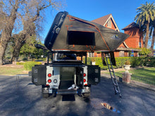 Load image into Gallery viewer, Tribe Basecamp Overland Trailer.  View of rear Fridge / cooler slide and side view of Tuff Stuff Alpha rooftop tent