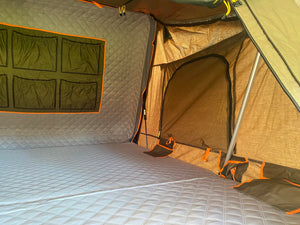 Tribe Basecamp Overland Trailer.  View of Tuff Stuff Alpha rooftop tent interior.
