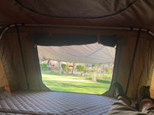 Load image into Gallery viewer, Tribe Basecamp Overland Trailer.  View from inside Tuff Stuff Alpha rooftop tent interior.